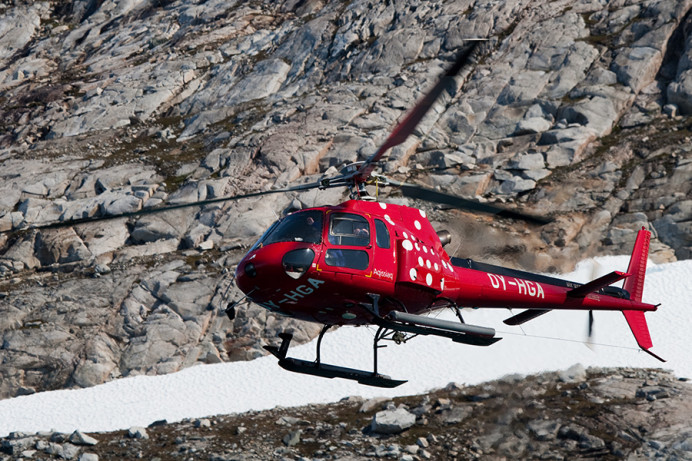 Medical evacuation helicopter leaving Napassorssuaq Fjord