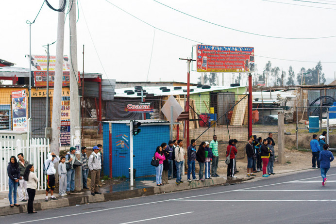 Waiting for the bus, early morning. Quito area.