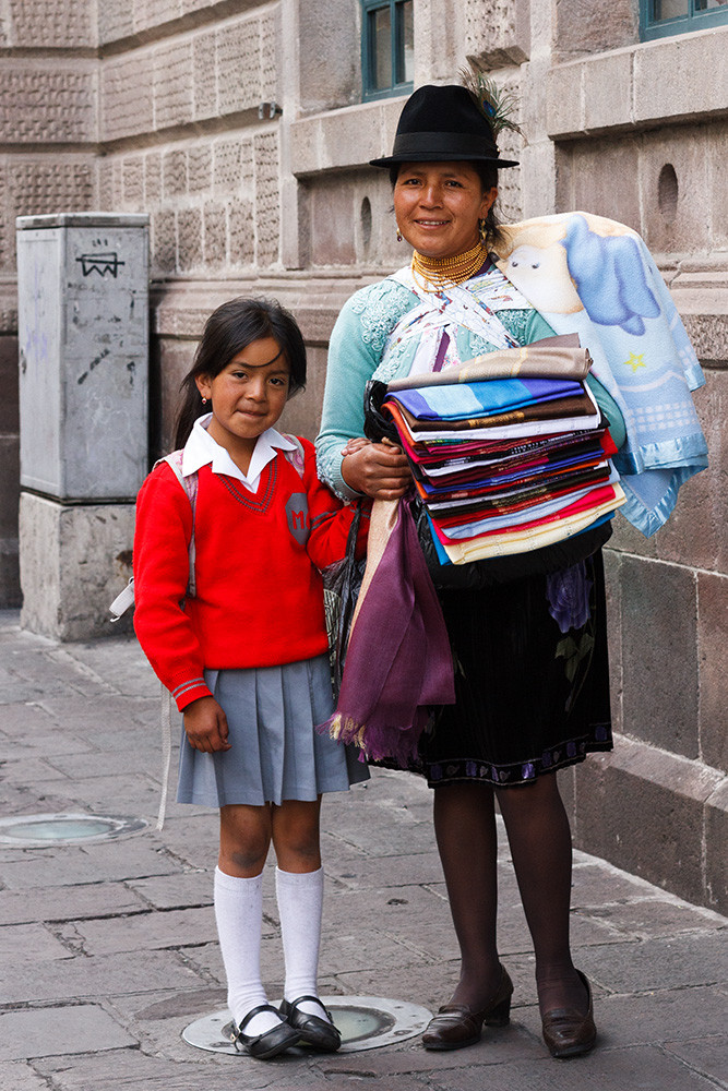 Woman selling wool scarves from Otovalo. Quito.