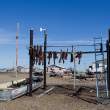 Relatively new drying rack, with wind indicator. Gambell, St. Lawrence Island, Alaska.