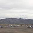 View of Nome from airport showing landmark DEW line (1950s radar network across the north) structures against the sky.