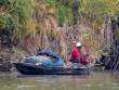 ManInRiverboat_OM01507