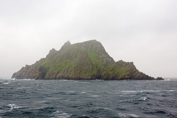 Skellig Michael in fog and rain. Location of Anchorite monastery with beehive huts, 6th century